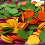 Multicoloured tokens in a bowl