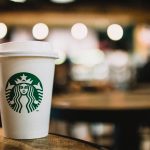 Starbucks coffee cup on blurred background