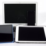 Image of tablet devices including iPads and MacBook Air.