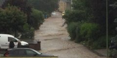 a street has become a stream during the 2021 German floods - view from my parents' window in Stolberg
