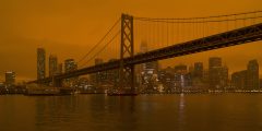 Smoke from the North Complex Fire settles over San Francisco, turning the daytime sky a dark orange.
