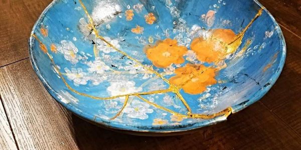 Hand-painted Kintsugi pottery bowl. Wikimedia Commons [Kintsugi, also known as kintsukuroi, is the Japanese art of repairing broken pottery by mending the areas of breakage with lacquer dusted or mixed with powdered gold, silver, or platinum]