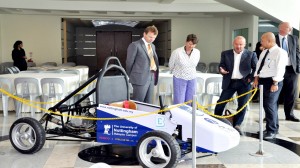 Mike interacting with Dr.Chan Kuan Yoong (on the right)of the Mechanical engineering faculty and Vice provost Professor Christine Ennew (on the left) with the student built F1 car