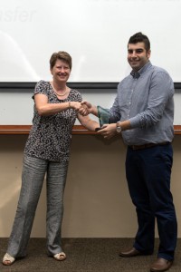 Figure 5 Professor Christine Ennew presenting Reza with the 3MT® overall winner award