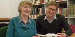Catherine and Nick Blake are seated in the Reading Room examining the memoirs of their ancestor recently donated to Manuscripts and Special Collections