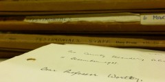A stack of folders of UCN Testimonials from the 1930s