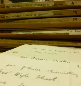 A stack of folders of UCN Testimonials from the 1930s