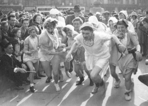 Students running in a fancy dress race, 1950