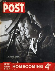 Black and white photograph showing three former Allied PoWs looking out of a plane window with joy.