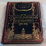 Leather cover with red rot around the edges, lots of gold and gilt decoration on the cover, title 'Contemporary Biographies' also in gold.