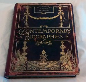 Leather cover with red rot around the edges, lots of gold and gilt decoration on the cover, title 'Contemporary Biographies' also in gold.
