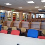 Photograph of rows of study carrels and book stacks at George Green Library.