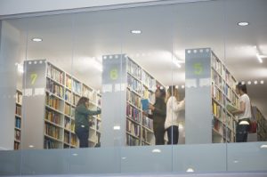 Photograph of students browsing bookstacks in George Green Library.