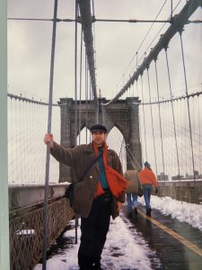 Photograph of Matt Marks standing on the Brooklyn Bridge