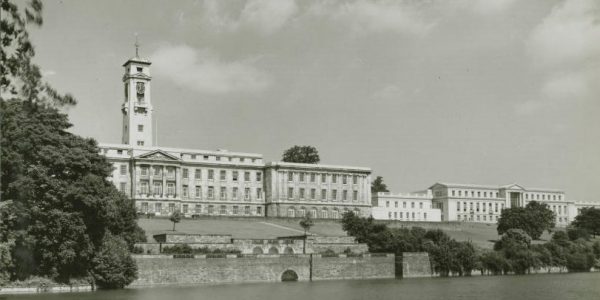 Photograph of the Trent Building and Portland Building, University of Nottingham, 1960s, with Highfields Park lake in front.