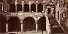 A sepia photograph of a courtyard and staircase at Palazzo Vecchio , Florence