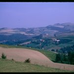 A colour photograph showing rolling hills in Poland