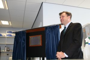Ed Balls standing beside an unveiled plaque at the FRAME Laboratory