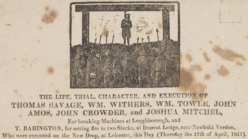 Black and white print of a body hanging from some gallows while a crowd look on.