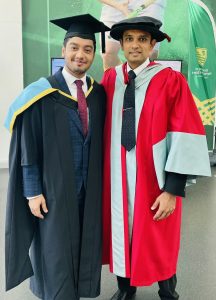 2 men in graduations gowns