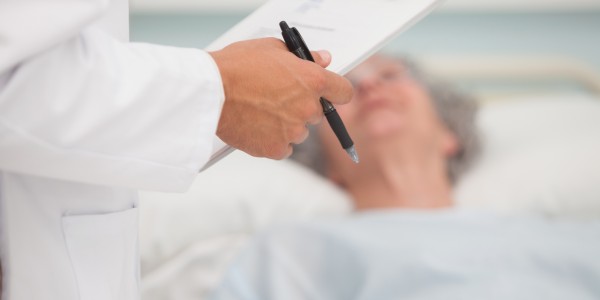 Elderly woman in hospital with doctor