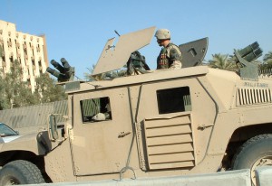 "Taken in the center of Baghdad, the capital of Iraq two months after the town was take by US army. US patrol in the protected area of the city on an armoured car. Canon 300D."