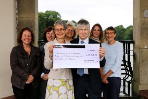 Denise Kendrick presents cheque to John Roberston with Robin Hood Way walkers