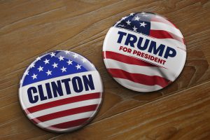 Washington, DC - April 10, 2016: Illustration of presidential campaign buttons of Hillary Clinton and Donald Trump running for the president's office.