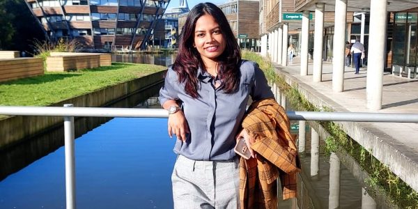 Picture of Ruehie standing by the lake on Jubilee Campus