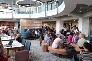 Image shows conference delegates networking in Conference Centre Atrium