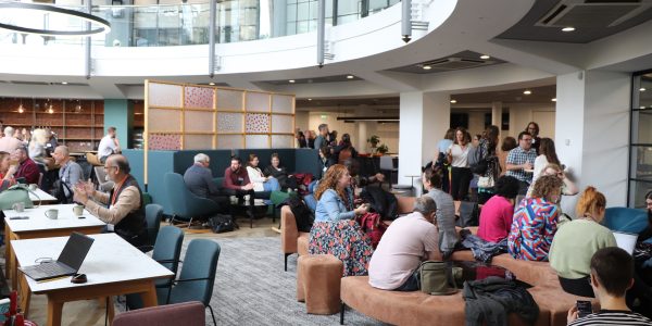 Image shows conference delegates networking in Conference Centre Atrium