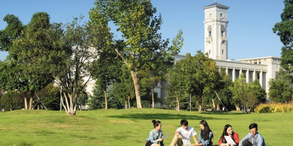 Group of undergraduate students socialising outside the Administration Building, Ningbo campus, China