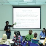 Female postgraduate student giving a presentation, Malaysia Campus