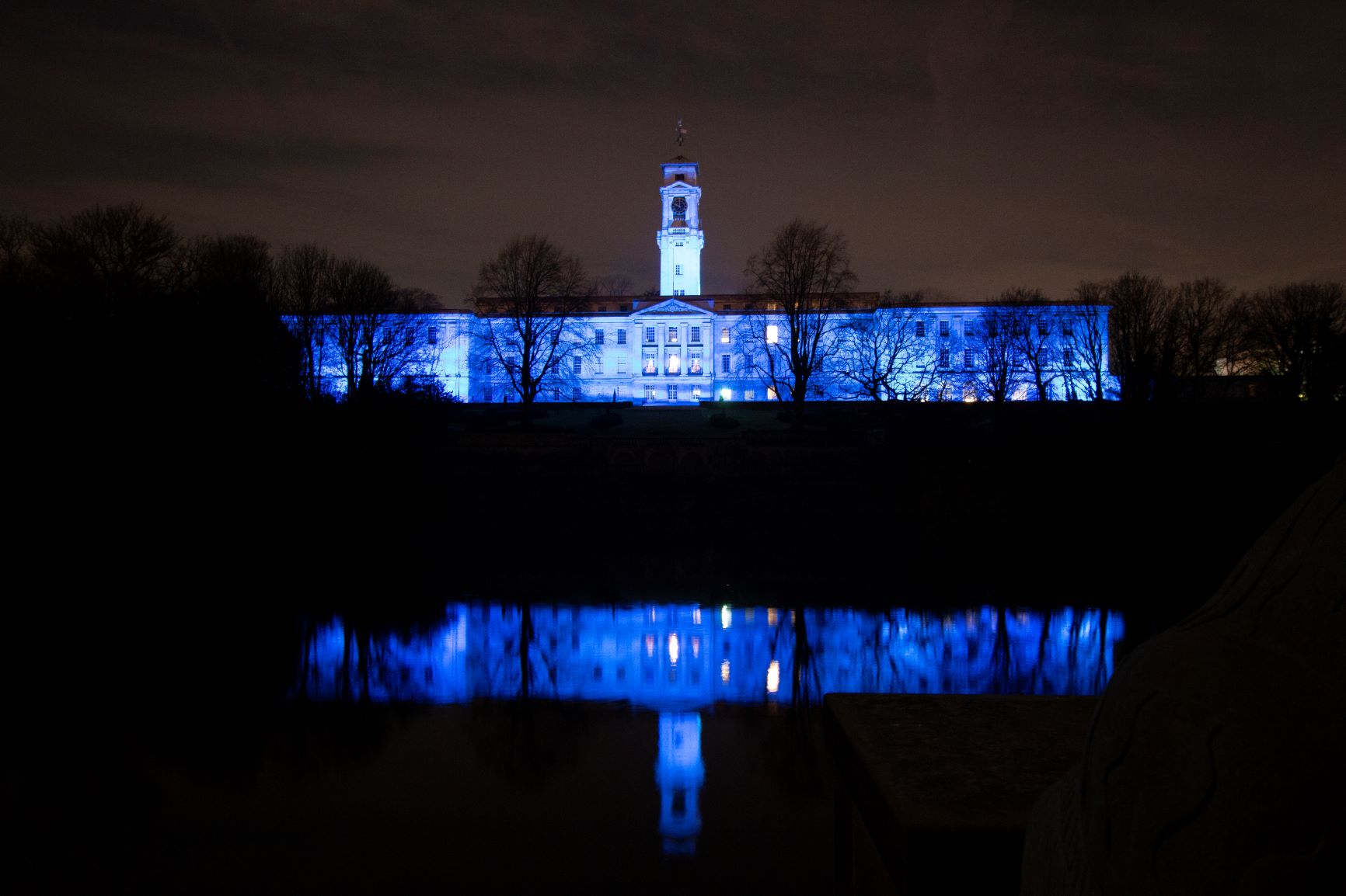 The Trent Building is lit up in blue