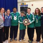 Molly receiving a gold medal for goalball, with the rest of her team.