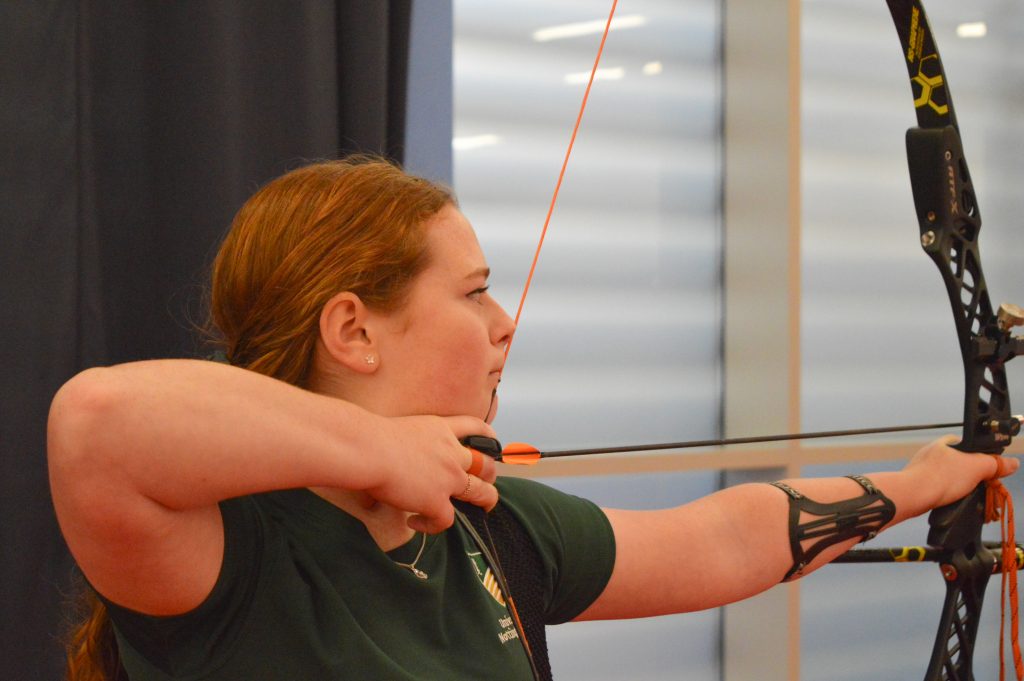 Louisa Piper taking a shot in archery