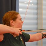 Louisa Piper taking a shot in archery