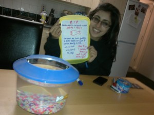 My friend Jasmin showing off her Fishy's memorial...strangely quite happily 
