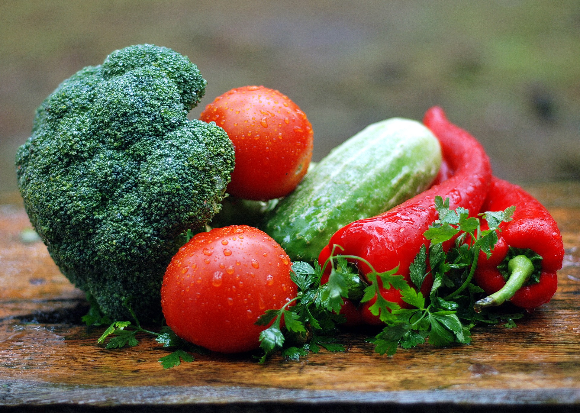 Eat well and save money - a range of vegetables on a wooden board