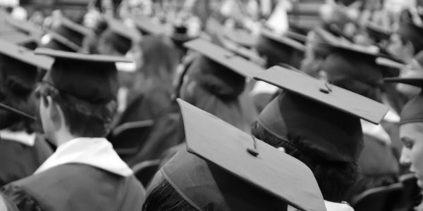 Employable graduates with graduation caps