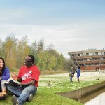 Postgraduate students relaxing outside on Jubilee campus