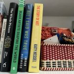 A shelf featuring a selection of books