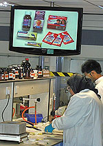 Photo of screen and students working