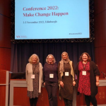 Rebecca and others standing on stage presenting at the Museums Association Conference